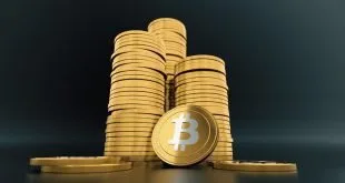 Pilhas de moedas douradas com o símbolo do bitcoin sobre fundo escuro