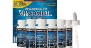 Frascos de minoxidil tópico a 5% da marca Kirkland ao lado da caixa e do conta-gotas