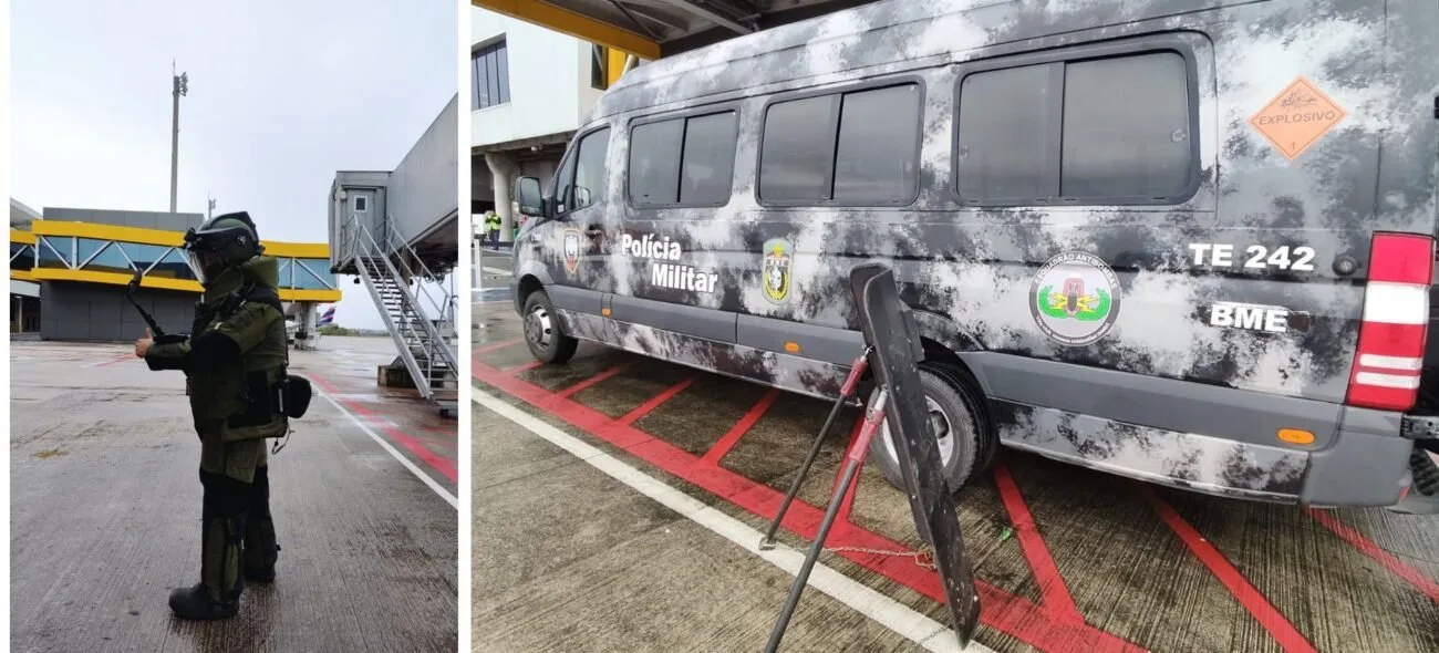 Policial com traje antibomba em pátio de aeroporto e van do esquadrão antibombas