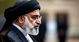 Homem de turbante preto e barba branca em retrato de perfil